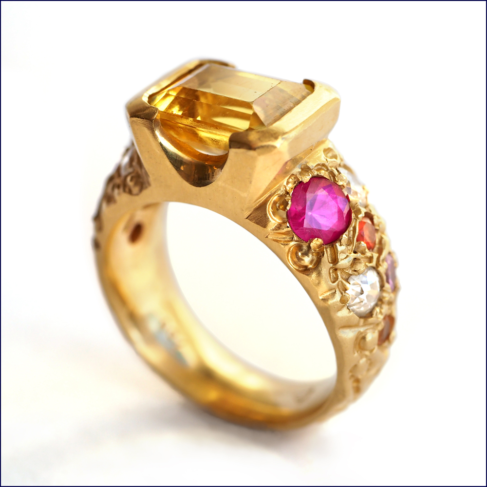 rejewellerated yellow sapphire ring with multi-coloured sapphires and diamonds.